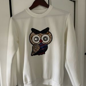 White Owl sweater.